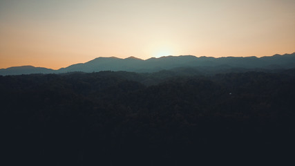 landscape mountains forests sky in the evening