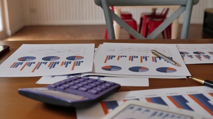 Business document Financial chart and graph put on desk table in office workplace. - Powered by Adobe