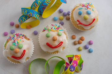 carnival clown muffins decorated with multi colored chocolate lentils