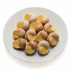still life of stuffed snail sauce, on a white background