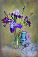 Still life with a beautiful bouquet of irises in a vase on the table © ALVERA