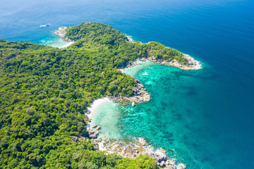 Aerial view of ocean waves, Beautiful tropical beach and rocky coastline and beautiful forest. Nga Khin Nyo Gyee Island Myanmar