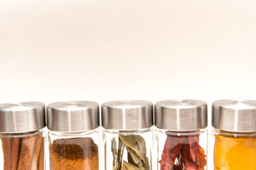 Isolated reusable spice jars on white background