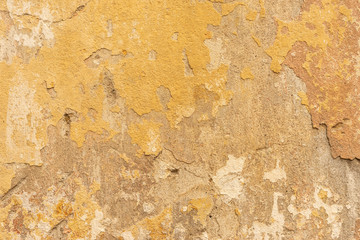 Wall with old plaster and paint stains. 
