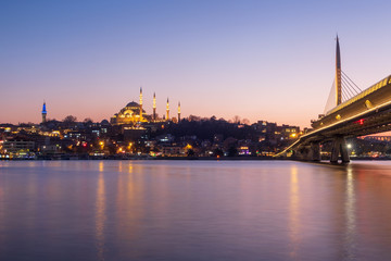Istanbul, Turkey - Jan 13, 2020: Halic Metro Bridge And Suleymaniye Mosque ,Golden Horn At Night, Istanbul, Turkey