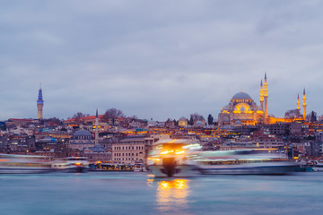 Istanbul, Turkey - Jan 16, 2020: Suleymaniye mosque and passengers Ferry at the Golden Horn, Istanbul, Turkey.