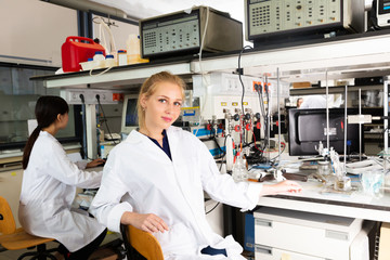 intelligent female student working with her coursemates