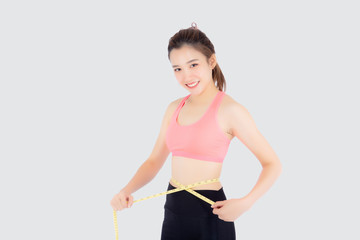 Beautiful slim young asian woman measuring tape thin waist wear uniform fitness isolated white...