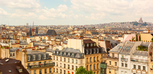Obraz premium Panoramic view, aerial skyline of Paris on city center, Sacre Coeur Basilica, churches and cathedrals, architecture, roofs of houses, streets landscape, Paris, France
