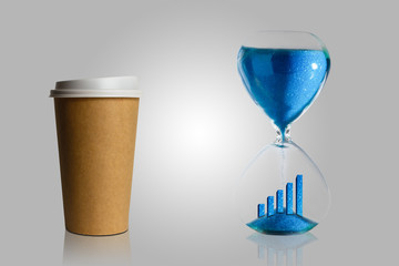 Coffee break in the process, coffee in a paper cup and hourglass blue background. Abstract.