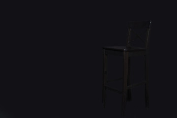 black chair stands on a black background