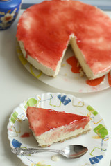 cheese cake with strawberry jam topping close up photo