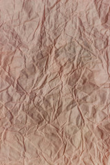vertical background of flesh-colored pressed paper texture