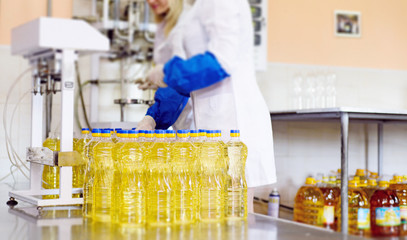 Sunflower oil factory. Factory line of production and filling of refined oil from sunflower seeds.