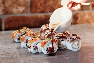 Sushi set with home delivery. Romantic dinner. Sushi in box.