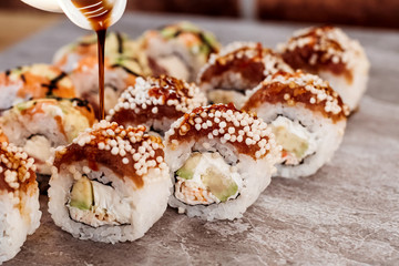 Sushi set with home delivery. Romantic dinner. Sushi in box.