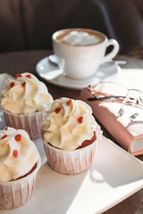 Cupcakes with hearts, coffee shop, romantic meeting for St. Valentine.