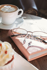 Cupcakes with hearts, coffee shop, romantic meeting for St. Valentine.