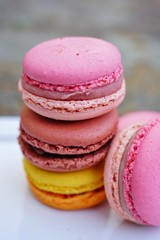 Colorful round macaron cookies on a platter