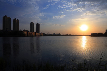 Waterfront city scenery in the evening, China