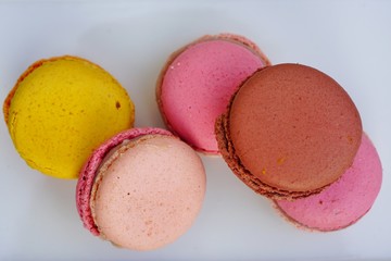 Colorful round macaron cookies on a platter
