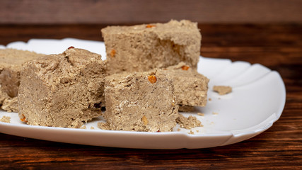 Halva in the billy tarіltsі on the dark wooden table_