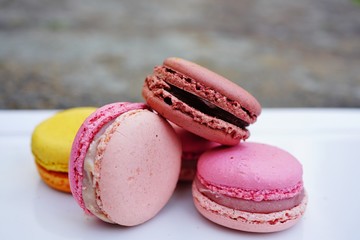 Colorful round macaron cookies on a platter
