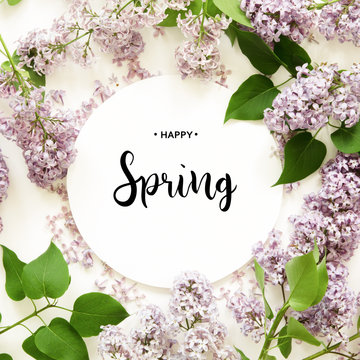Inscription Happy Spring. Lilac flowers on white background. Spring flowers. Top view, flat lay. - Image