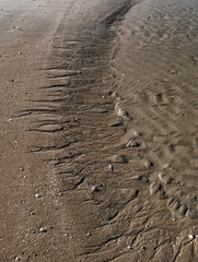 Sand patterns after flow on beach