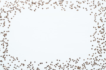 Christmas composition. Christmas golden glittering decorations on color background. Flat lay, top view, copy space - Image