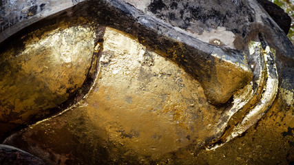 Close-up of an old Buddha statue in a Thai temple