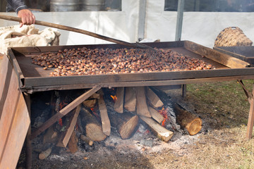 A man is roasting chestnuts - 322084106