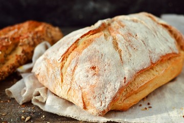 Crispy bread on a dark background, top view. A variety of bread, place for text.