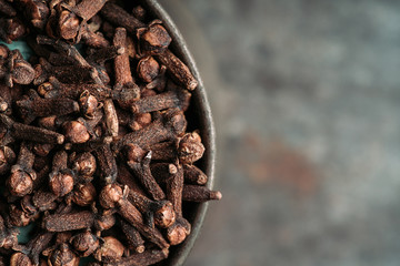 Dry cloves spices on the dark rustic background. Selective focus. shallow depth of field.