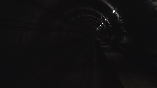 Ultra high definition 4k time lapse video of fast high speed subway train moving through dark tunnel 3840x2160
