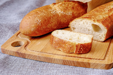 Fresh warm baguette with a crispy crust. Sliced for Breakfast. For the morning sandwich.