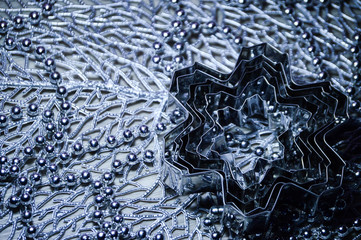 Metal molds for biscuits of various shapes on a gray background with New Year's garland