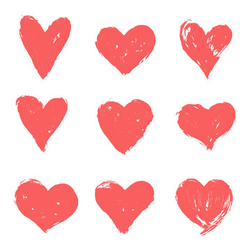 Set of pink, red hand drawn hearts. Vector grunge heart shapes.