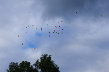 at graduation, children released balloons into the sky