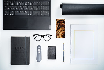 Clean minimalistic modern desk setup flat lay top down view