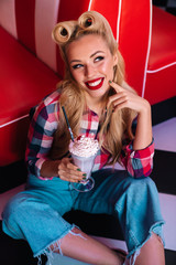 Photo of gorgeous cheerful woman drinking milkshake