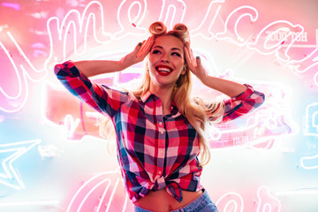 Photo of cheerful caucasian woman posing and smiling at camera