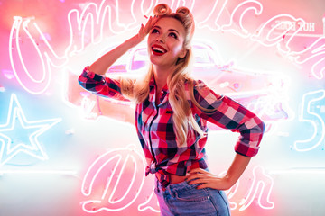 Photo of cheerful caucasian woman posing and smiling at camera