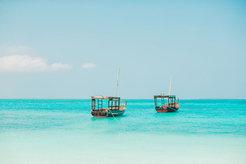 Beautiful cozy bay with boats and clear turquoise water