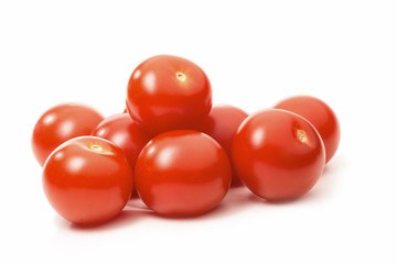 Ripe tomatoes isolated against white background