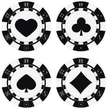 Black and white poker chips set with card suits hearts, spades, diamonds, clubs.