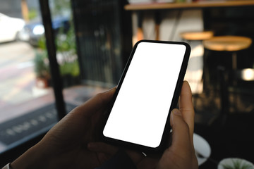 Close up of woman using cell phone,sending massages on the coffee shop.having sunbath.Phone with black screen,texting,video calls,