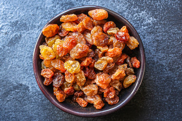 raisins, delicious dried grapes (fresh fruit vitamins) menu concept background. top view. copy space