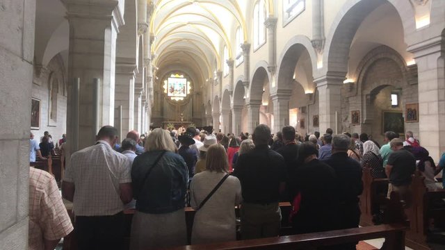 Bethlehem, Palestine - October 20, 2019: Basilica of the Nativity tourists inspect the interior part 8 4K
