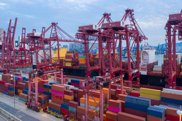Cranes loaded containers on a ships board, view from above